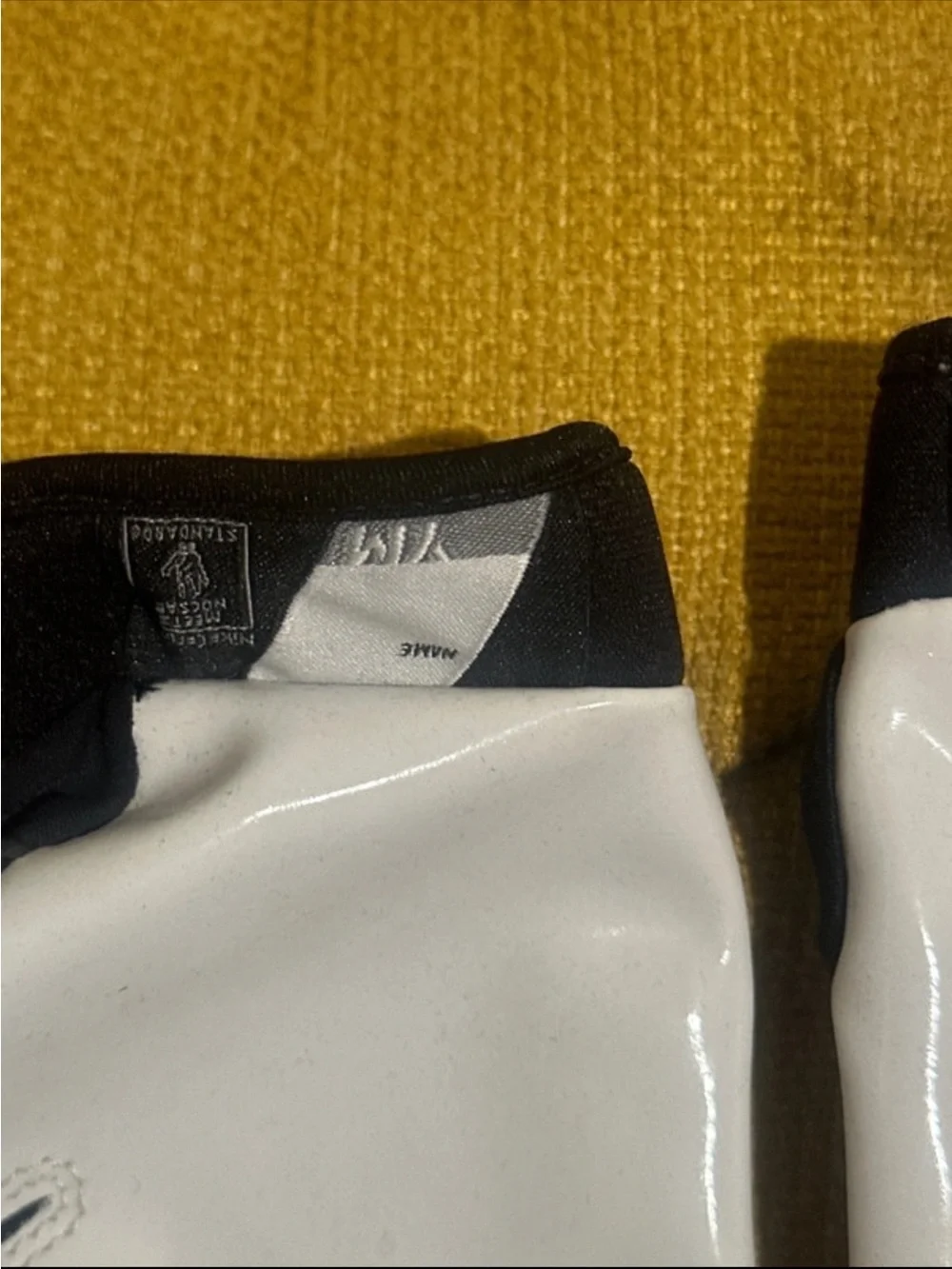 Nike youth medium Black and White football Gloves